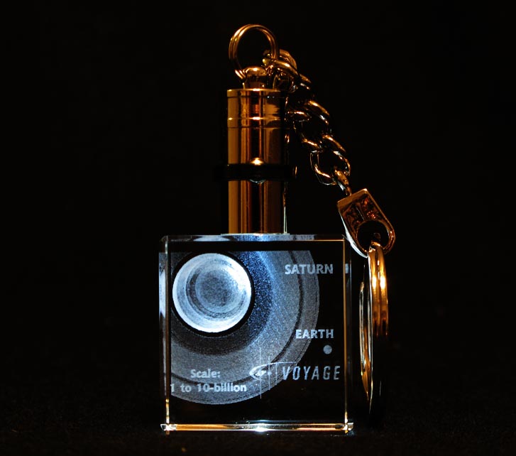 An illuminated crystal keychain containing the Voyage exhibition's Saturn and Earth, laser-sculpted in 3D at one 10-billionth actual size. Click on Image for Details