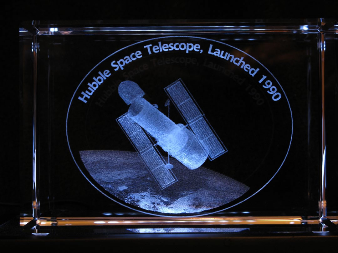 Celebrating the 20th  Anniversary of the launch of the Hubble  Space Telescope, a large illuminated 3D  sculpture inside solid crystal. Click on Image for  Details